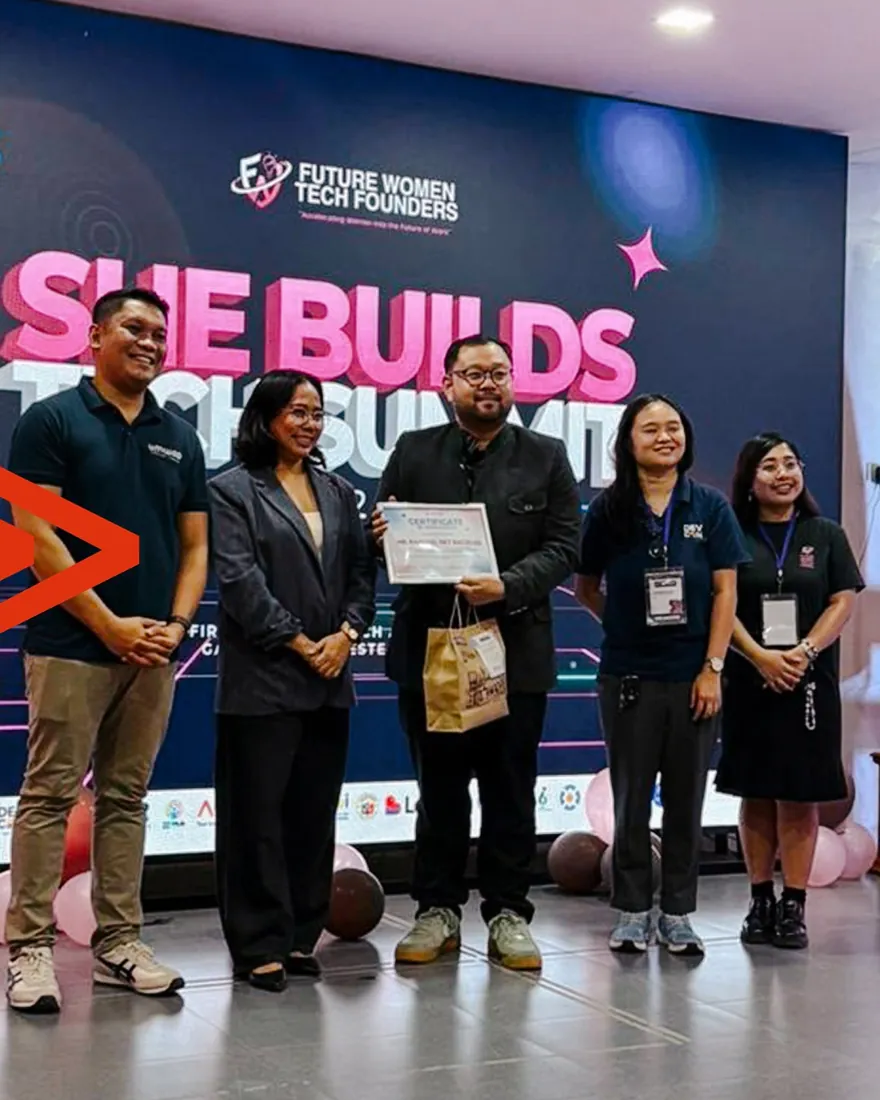 Raphael Bacolod receiving a certificate of appreciation on stage at the She Builds Tech Summit